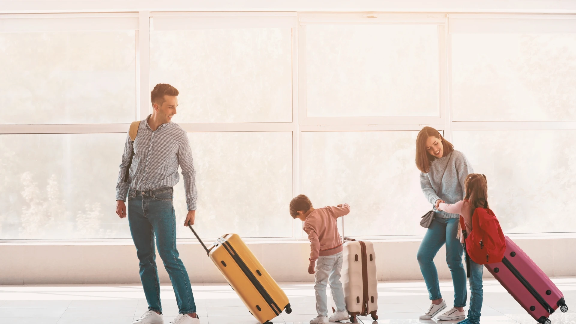 family carrying luggage to the corfu airport luggage storage room