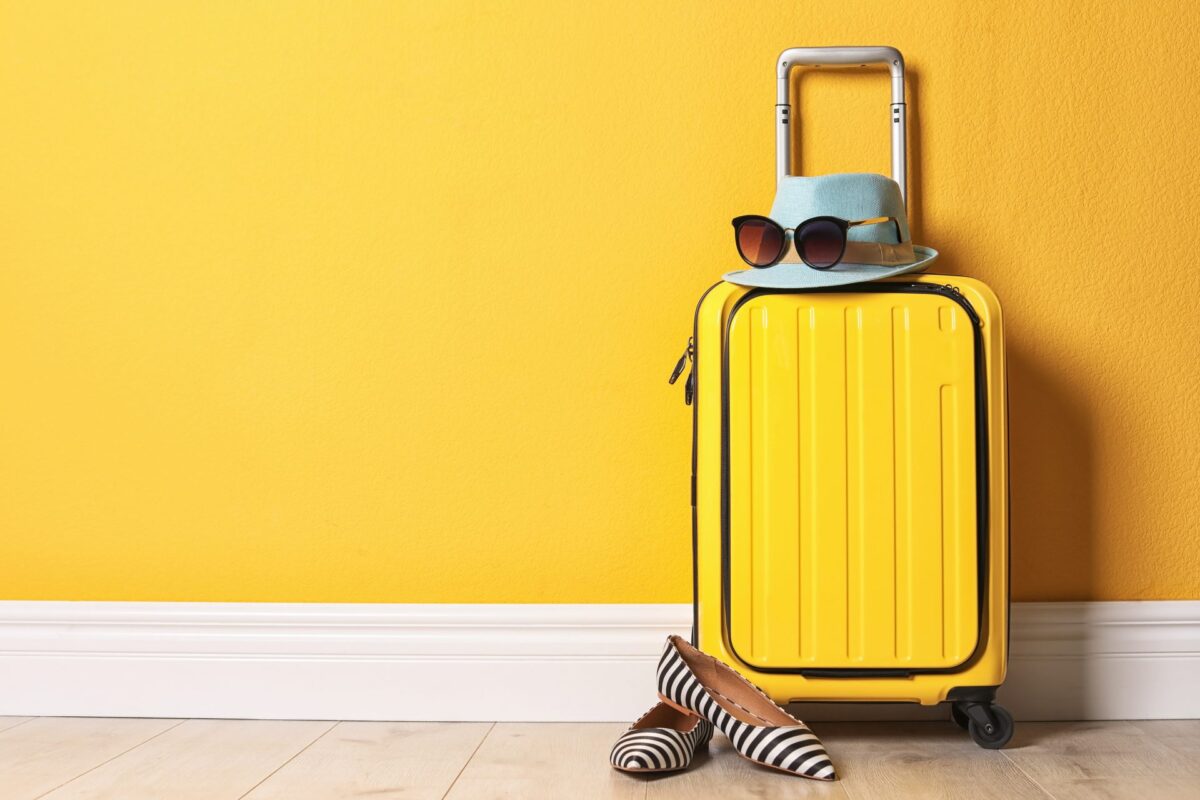 Yellow suitcase ready for luggage storage in Corfu 2025